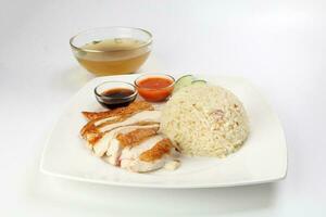 South east asian style chicken rice set steamed roasted sliced chicken with soup dark chilli sauce malaysia china photo