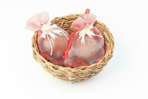 Egg flower or bunga telur a traditional malay wedding gift important part of reception door gift in straw basket photo