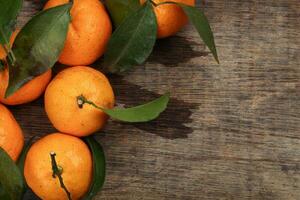 mandarin orange green leaf wood crate box top view copy text space frame on rustic wooden background photo