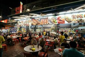 KUALA LUMPUR, MALAYSIA- MARCH 28, 2018 Hosting a lot of hawker stalls and seafood restaurants, Jalan Alor is one of the most famous roads in Kuala Lumpur for food. photo