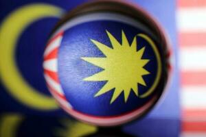 Malaysian flag refraction through glass crystal ball country independence patriot concept photo