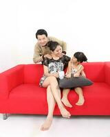 South East Asian young father mother daughter son parent girl child activity indoor photo