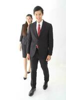 South East Asian young Chinese Indian Malay headscarf man woman wearing formal business office ware on white background stand pose togetherness team photo