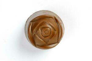 Chocolate truffle hart square cube rose flower shape on white background photo