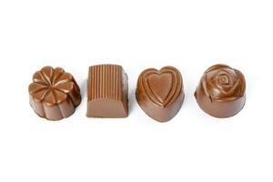 Chocolate truffle hart square cube rose flower shape on white background photo