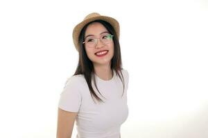 Beautiful young south east Asian woman wearing eyewear golden frame glasses hat pose fashion style white background look around copy text space photo