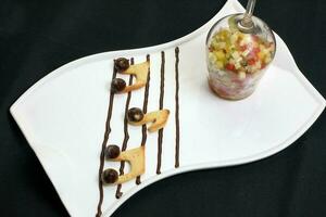 Musical note cookie biscuit and fruit salad photo