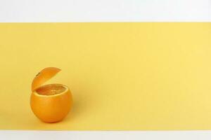 Healthy Orange Cut floating top slice juice drink idea concept on yellow white background photo