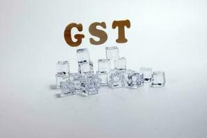 Cold tax GST Goods and Service Tax alphabet ice cube freeze cool on white background photo