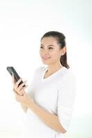 beautiful young south east Asian Chinese holding phone thinking wondering on white background photo