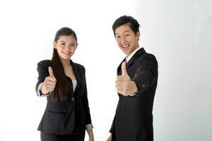 South east Asian young Chinese man woman wearing formal business office ware on white background thumbs up photo