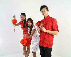 South East Asian young Malay Chinese Indian man woman wearing traditional chinse cheongsam dress on white background shop exchange gift orange greetings share racial unity harmony hand fan photo