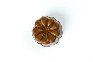Chocolate truffle hart square cube rose flower shape on white background photo