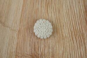 Decorative traditional biscuit on palm leaf plate photo