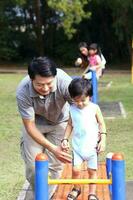 South East Asian young father mother daughter son parent boy girl child activity photo