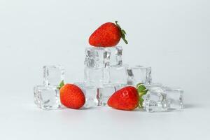 Strawberry blueberry berry read black ice cube on white background photo