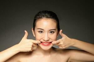 Young beautiful Asian woman facial expression photo