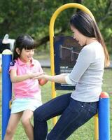 South East Asian young father mother daughter son parent boy girl child activity photo