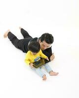 South East Asian young father mother daughter son parent boy girl child activity indoor photo