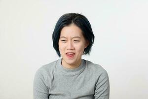 Young attractive Asian chinese malay woman pose face body expression mode emotion on white background disgusting photo