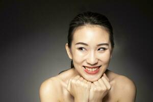 Young beautiful Asian woman facial expression photo