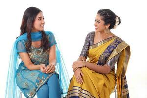 Two South east Asian Indian race ethnic origin woman wearing Indian dress costume sharee and salwar kameez multiracial community on white background photo