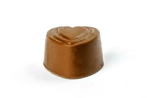 Chocolate truffle hart square cube rose flower shape on white background photo