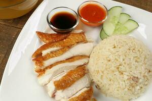 South east asian style chicken rice set steamed roasted sliced chicken with soup dark chilli sauce malaysia china photo