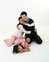 South East Asian young father mother daughter son parent boy girl child activity indoor photo