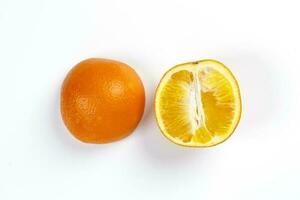 Orange Fruit half cut slices top view white background photo