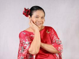 Elderly senior Asian woman posing facial expression photo