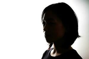 Silhouette dark black portraits of young southeast Asian woman on white background romance love care friends emotion expression thoughts photo
