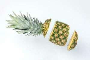 Pineapple whole rough skin slice chopped flying elevated photo