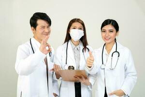 Young Asian male female doctor wearing apron stethoscope ok thumbs up photo