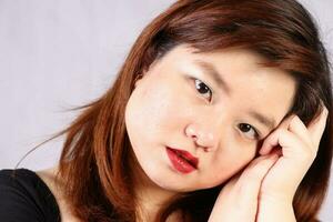 Young attractive southeast Asian woman posing facial expression photo