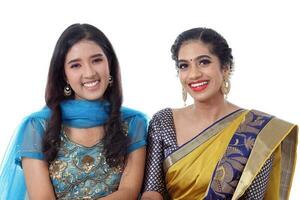 Two South east Asian Indian race ethnic origin woman wearing Indian dress costume sharee and salwar kameez multiracial community on white background photo