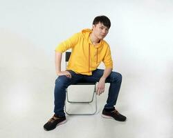 Young good looking Asian chinese malay man pose face body expression mode emotion on white background look photo