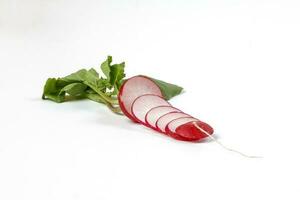 Small red radish on white background photo