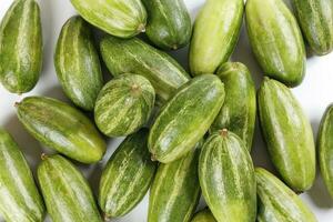 pointed gourd potol green vegetable on white background photo