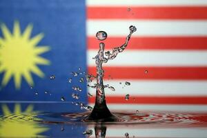 Water droplet drop splash collision dripping pillar Malaysia Flag reflection refraction independence country patriot photo