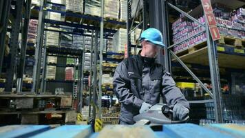 Caucasian Pallet Lifter Operator Moving Products in the Storage Facility video