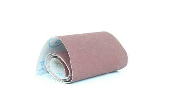 sandpaper roll isolated on white background photo