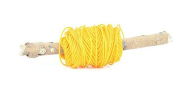 roll of yellow nylon rope isolated on white background photo