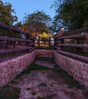 Plastic artificial wood fence in zoo photo
