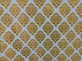 Gold white damask seamless pattern,walpaper .Elegant classic texture,background design,reto vintage pattern wallpaper ,poster,banner,greeting card photo