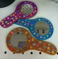 Decorative round handcrafted mirror,Multicolor ladies hand mirrors on white background photo