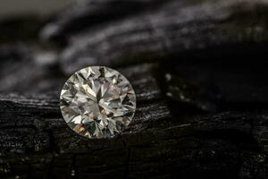 Diamond Gemstone on Black Coal photo