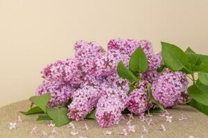 Violet Pink Lilac Flowers Bouquet on Table photo
