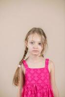 Little girl with pigtails and pink dress photo
