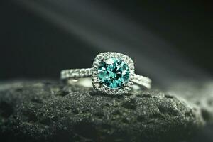 Emerald Ring on Black Natural Stone photo